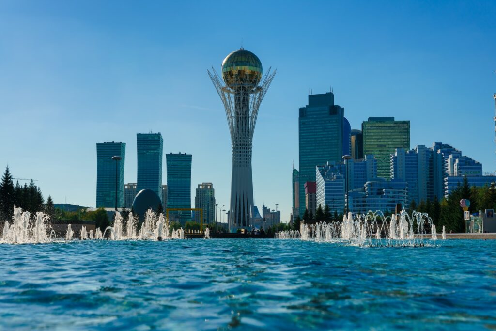 a city skyline with a fountain