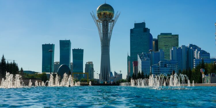 a city skyline with a fountain