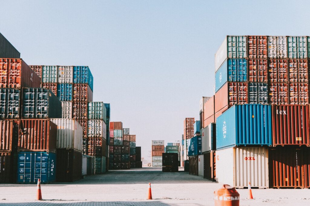 a large amount of containers are stacked on top of each other