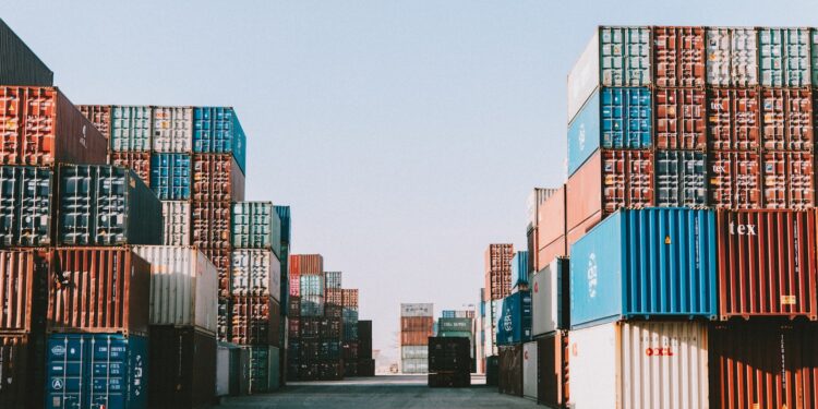 a large amount of containers are stacked on top of each other