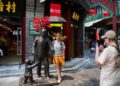 (240710) -- BEIJING, July 10, 2024 (Xinhua) -- A tourist from Switzerland poses for a photo on Qianmen Street in Beijing, capital of China, July 10, 2024.
  Currently, foreign nationals from 54 countries are eligible for the 72/144-hour transit visa-free policies that are effective at 38 ports in 18 provincial-level regions across China.
  China recorded 14.64 million inbound trips made by foreigners in the first half of this year, up 152.7 percent year on year, following measures introduced since January, the National Immigration Administration (NIA) announced on July 5.
  According to NIA, the number of visa-free entries made by foreigners exceeded 8.54 million from January to June, accounting for 52 percent of the inbound trips and representing a year-on-year surge of 190.1 percent. (Xinhua/Ju Huanzong)