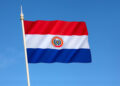 National flag of Paraguay - adopted in 1842. It is unusual because the insignia differs on obverse and reverse sides of the flag (this the obverse side).