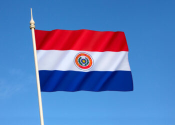 National flag of Paraguay - adopted in 1842. It is unusual because the insignia differs on obverse and reverse sides of the flag (this the obverse side).